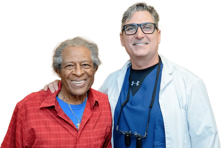 Dr. Lance Timmerman with a patient after same-day full-arch dental implants — South Seattle Smiles, Tukwila WA